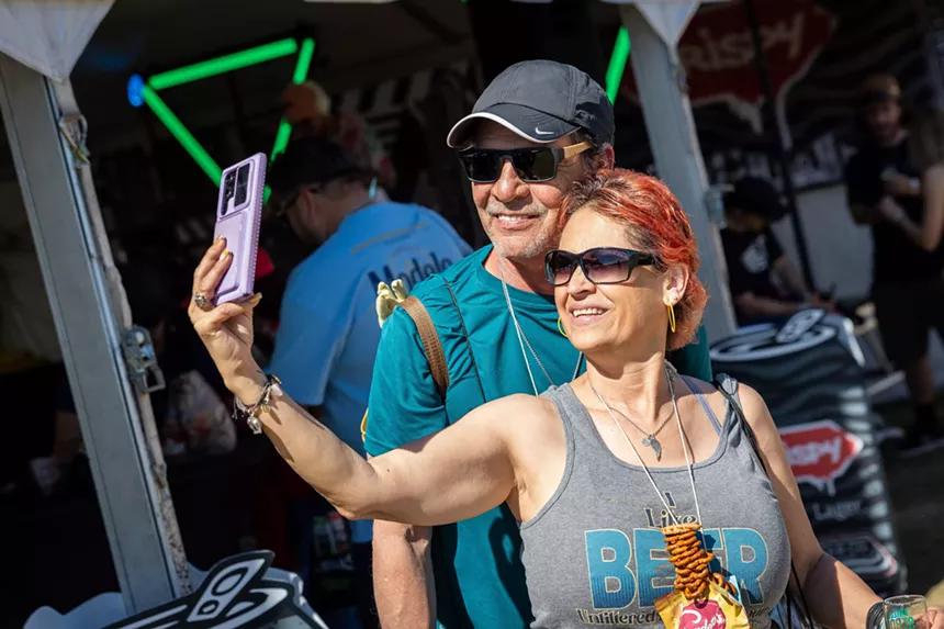 Couple poses for selfie.