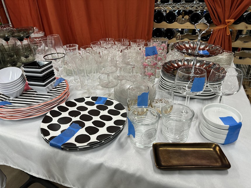 A table filled with plates and glasses.