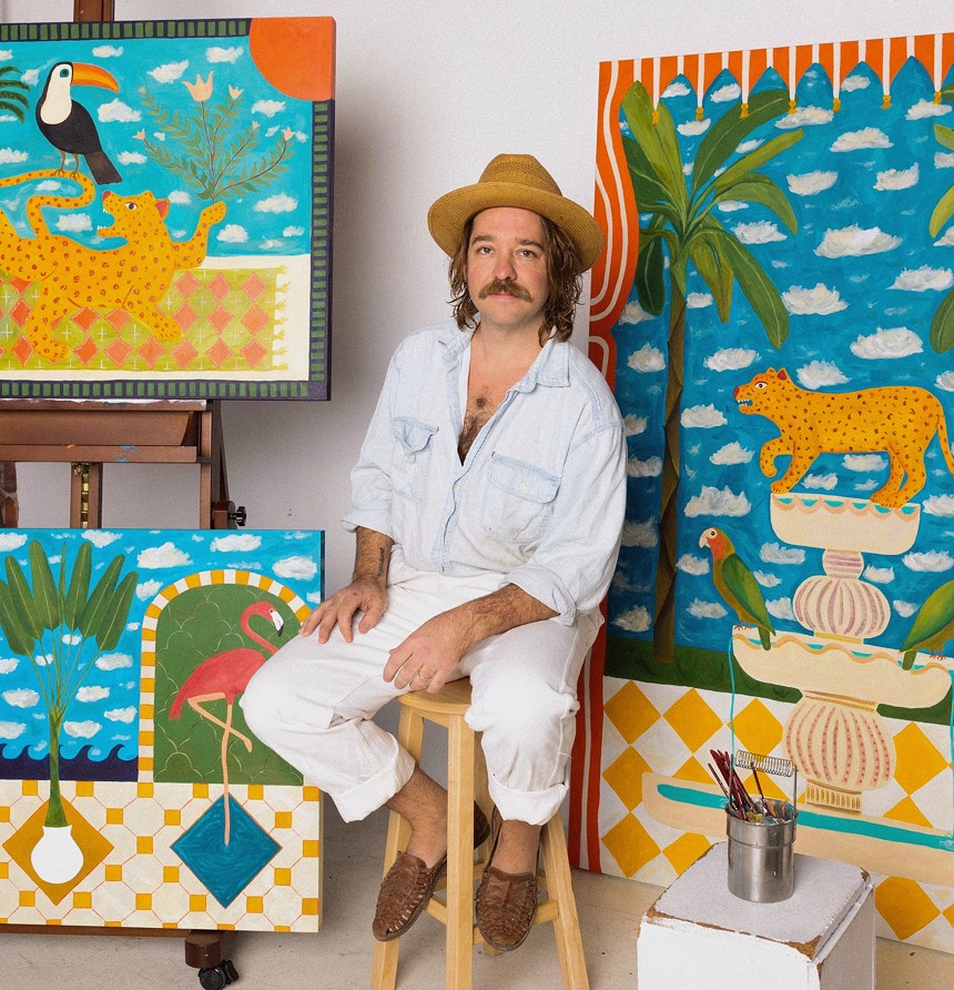 Derek Christensen with his artworks.