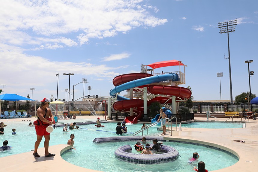 A public pool facility with a waterslide.