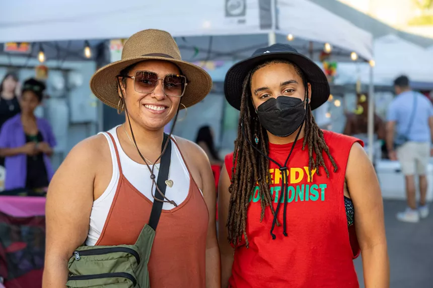 Two people, including one wearing a mask.