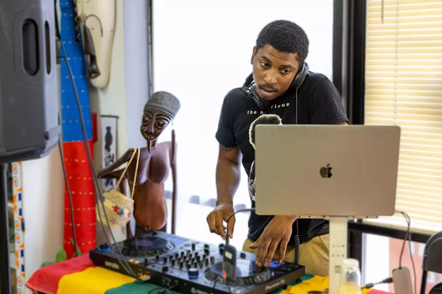 A man being a DJ.