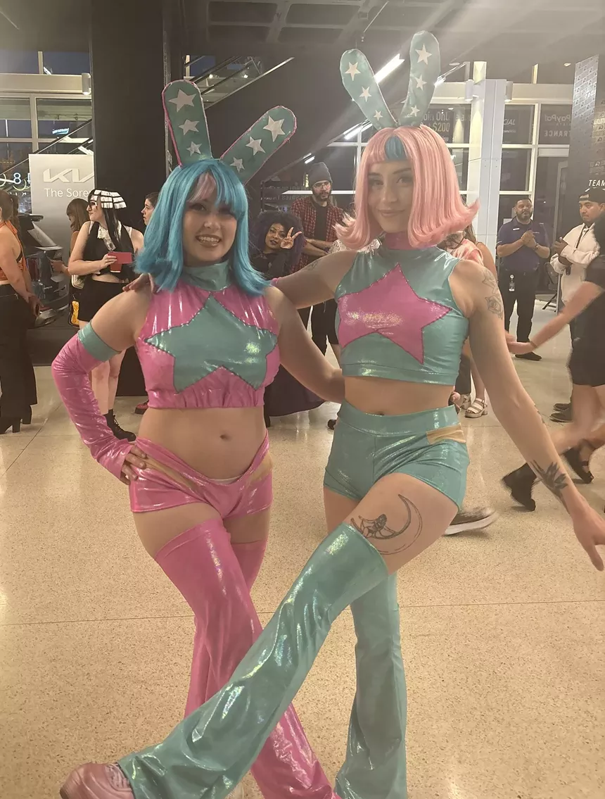 Two women in costumes.