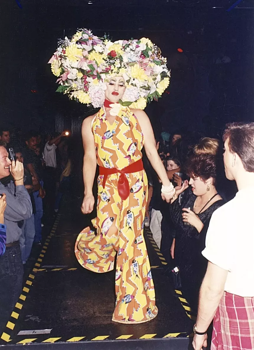 A person in costume walking down a catwalk.