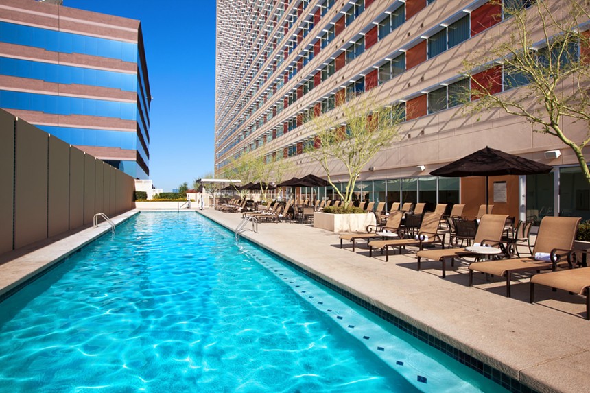 A pool on the roof of a hotel.