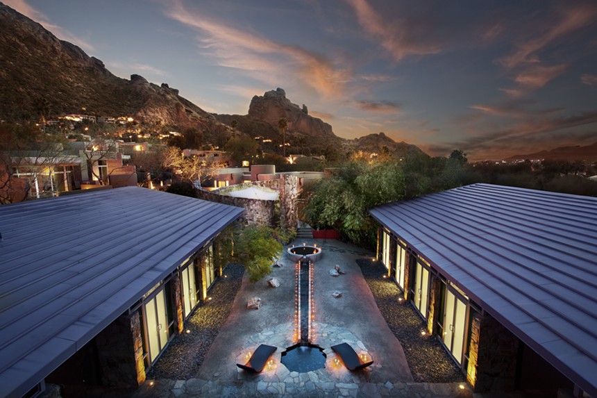 A resort with a mountain in the background.