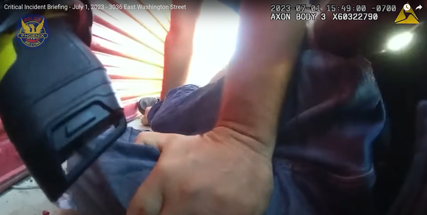 body-cam footage of arms holding down a man while a taser is being pointed at him