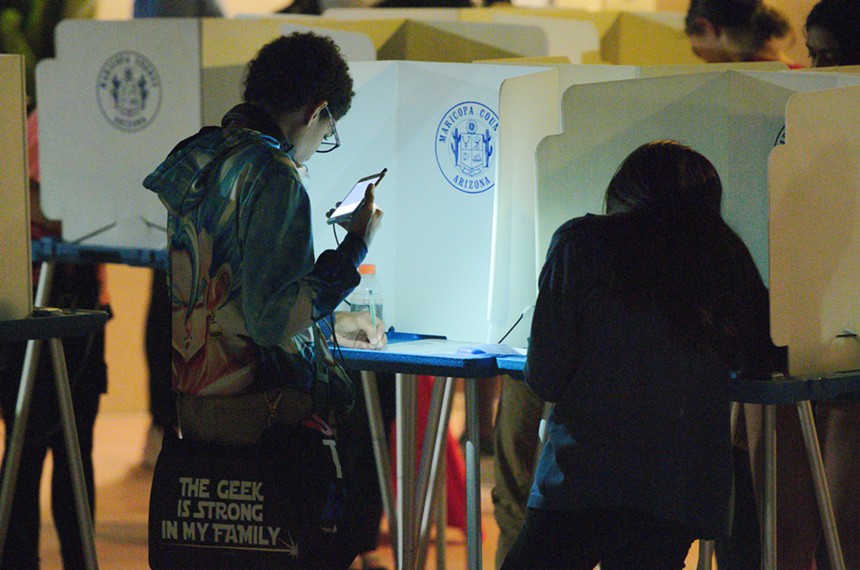 a young person at a voting booth