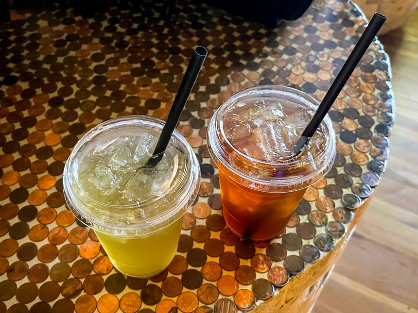 Two drinks in plastic cups.