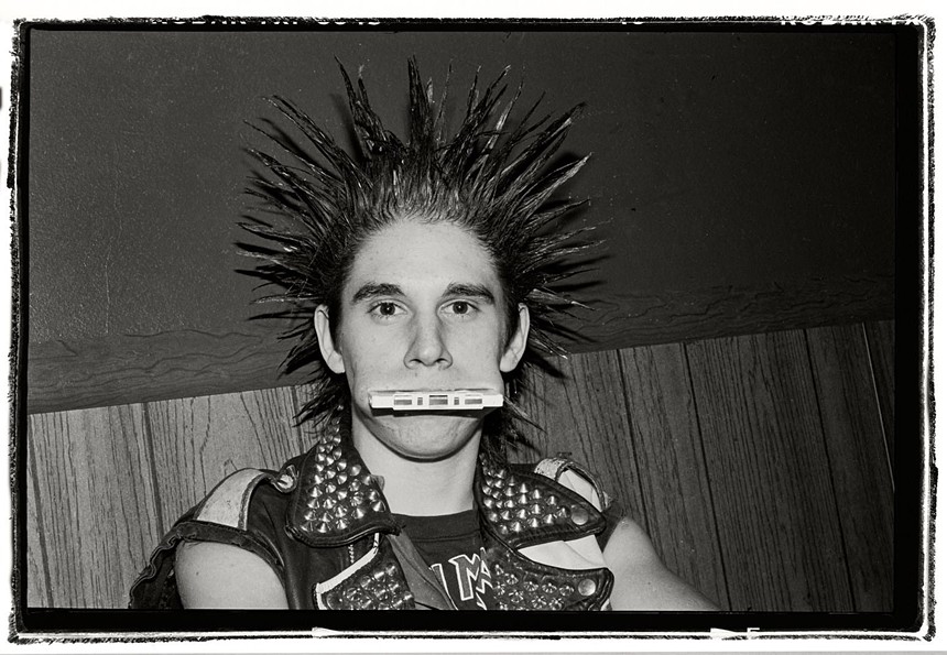 A black and white photo of a punk rocker.