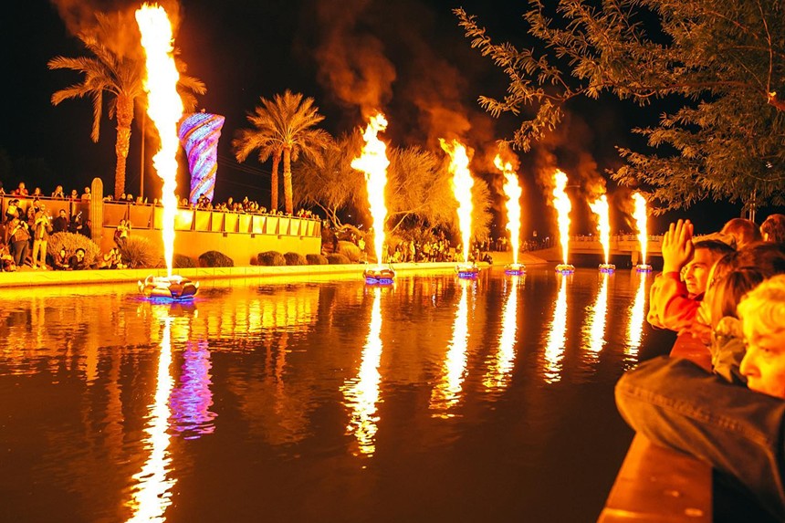A fire-based art installation on a canal.