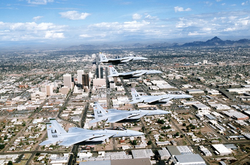 In 1987, five F-15 Eagle fighters fly over downtown Phoenix.