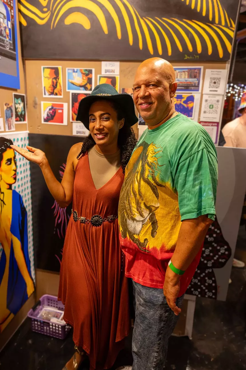 A couple in colorful clothes.