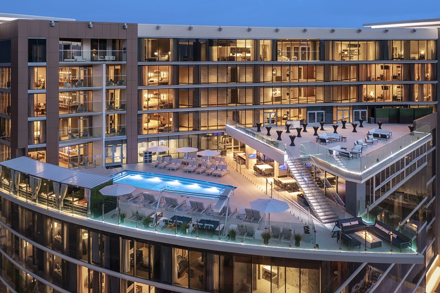 A drone shot of a rooftop pool at a hotel.