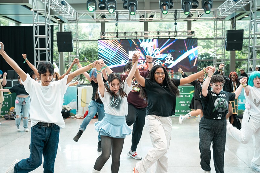 A group of young people dancing.