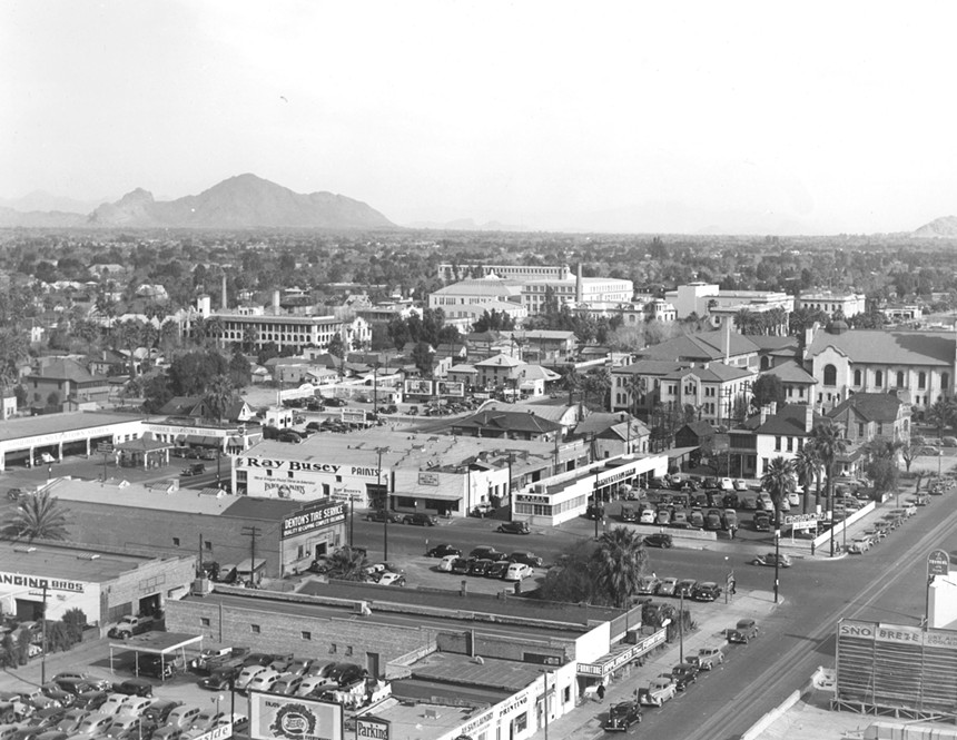 a photo of downtown phoenix from 1935. Ray Busey Paints can be seen, with Camelback Mountain in the background