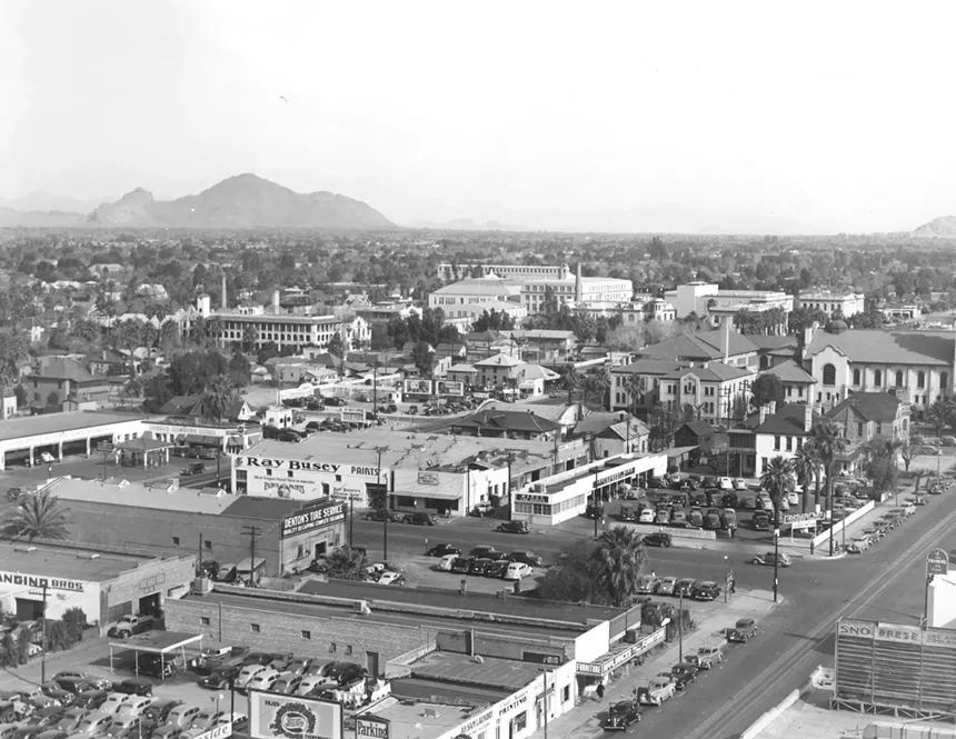 a photo of downtown phoenix from 1935. Ray Busey Paints can be seen, with Camelback Mountain in the background