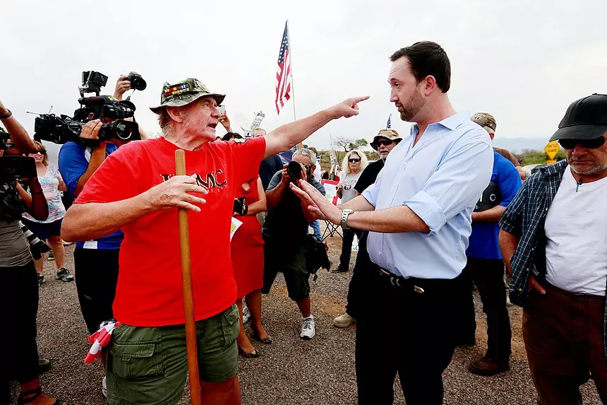 adam kwasman argues with another man