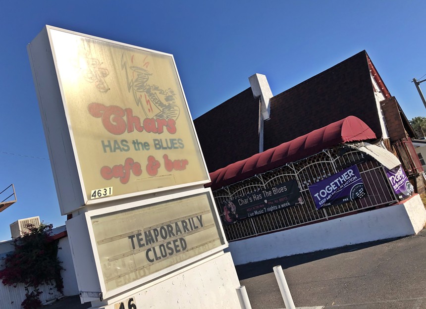 The sign and exterior of a closed bar.