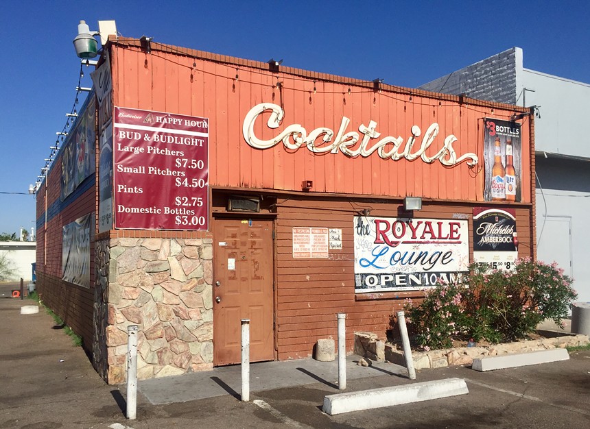 The exterior of a bar in daylight.