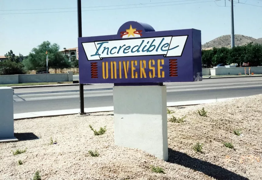 A colorful street sign for a big-box electronics store.