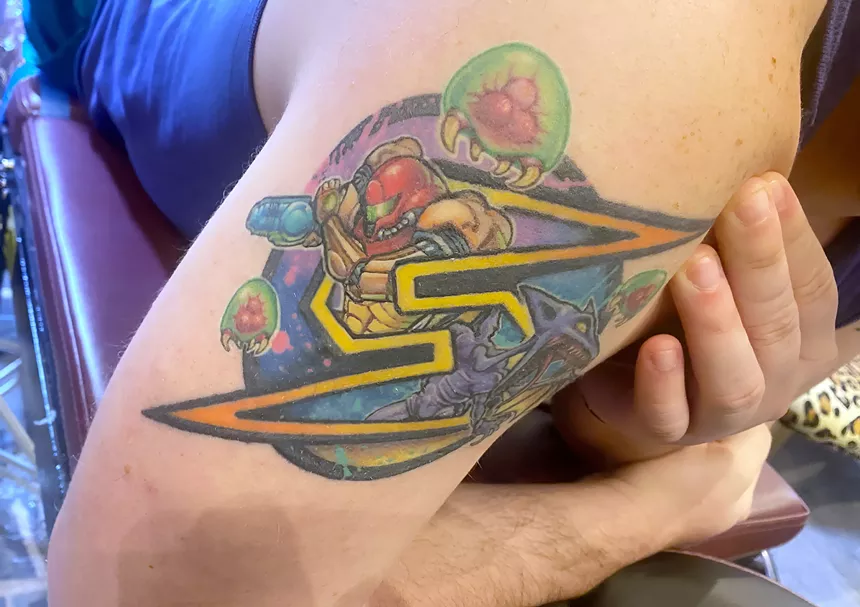 An arm tattoo inspired by "Metroid."
