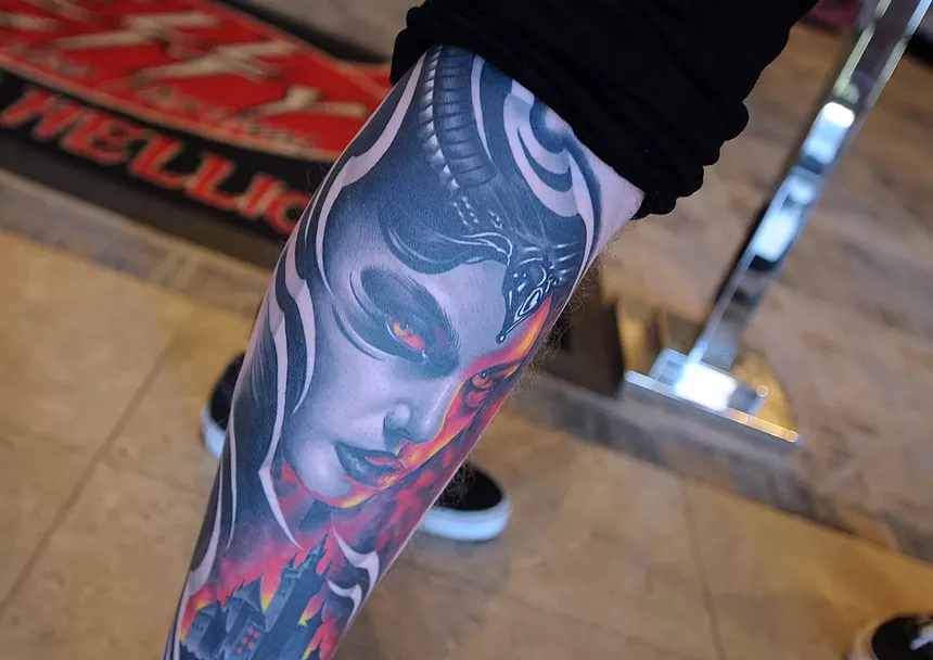 A tattoo on a person's calf.