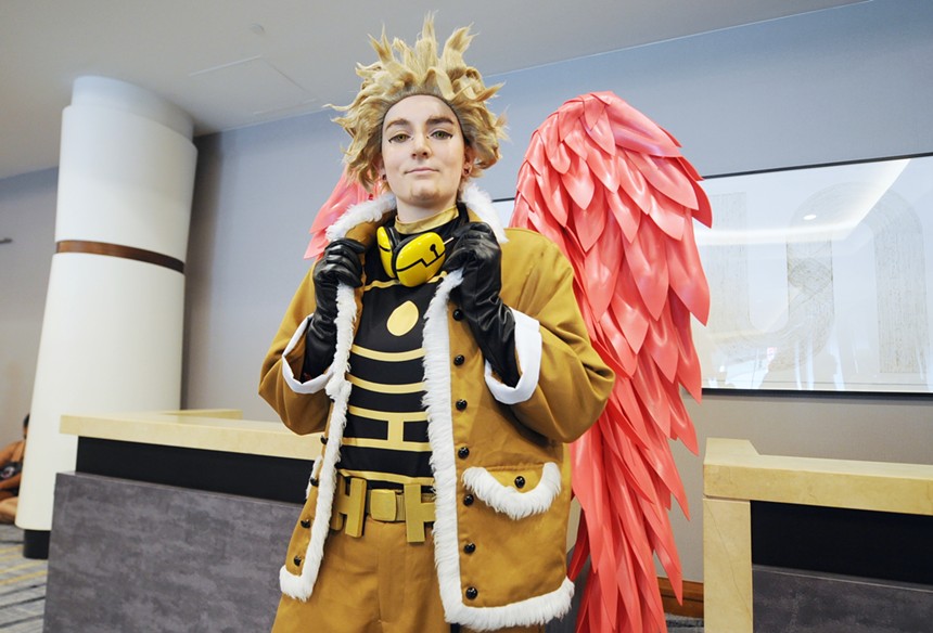 A person wearing a costume with wings.