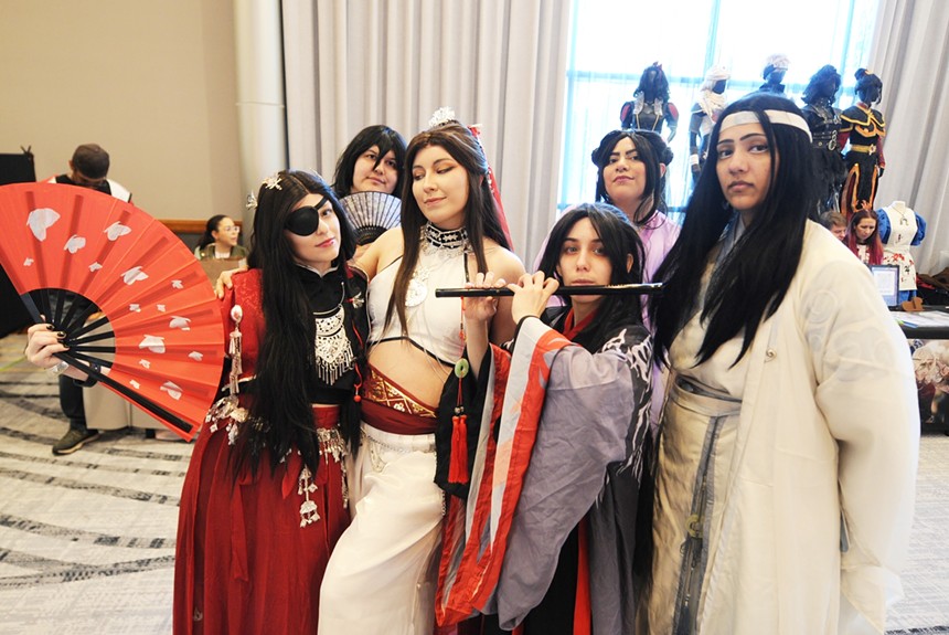 Six people dressed in traditional Japanese costumes.