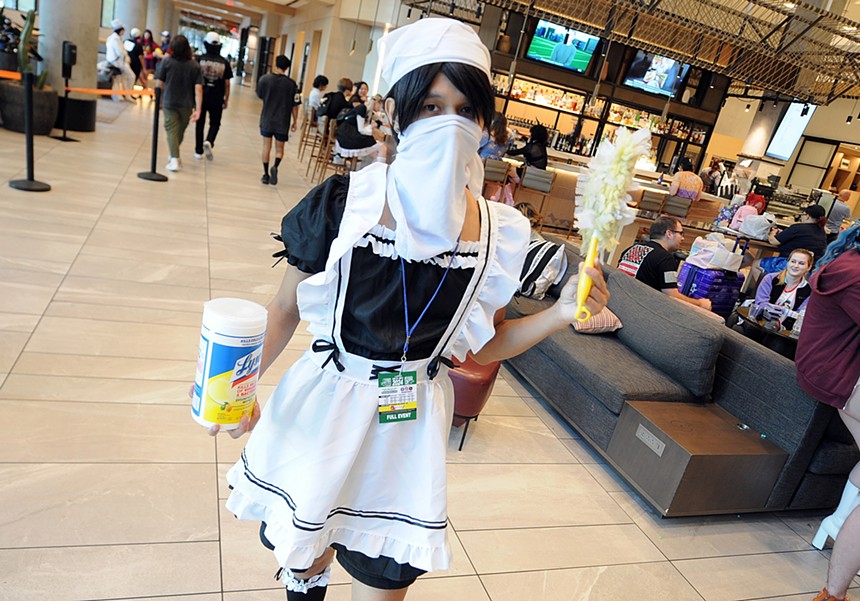 A person dressed in a maid costume.