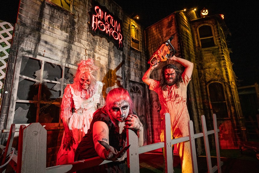 A trio of haunted house actors in costume.