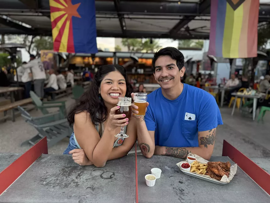 two people with beers