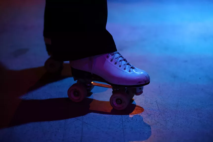 Someone on roller skates seen from just their foot.