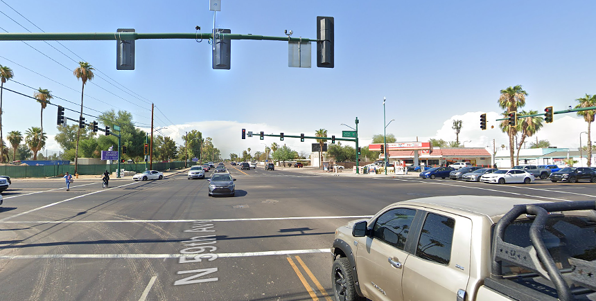 cars going through a city intersection