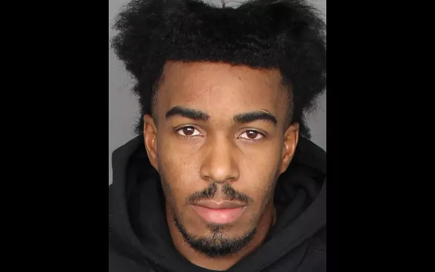a mugshot of a young man