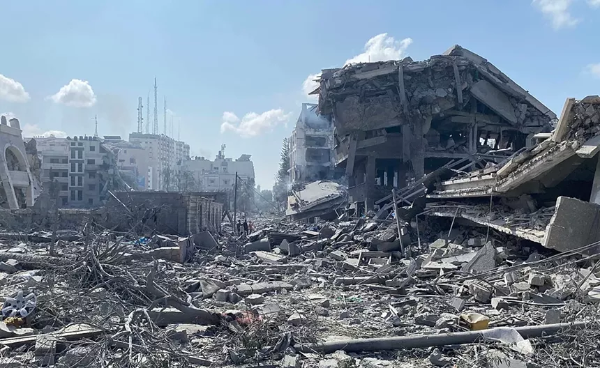 Palestinians inspect the damage following an Israeli airstrike on the El-Remal aera in Gaza City on October 9, 2023.