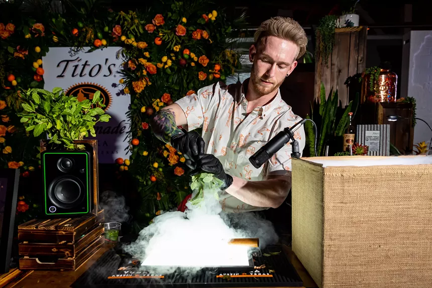 Man pouring a cocktail.