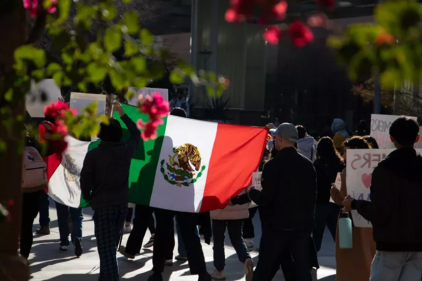Protesters carried flags and pro-immigration signs.