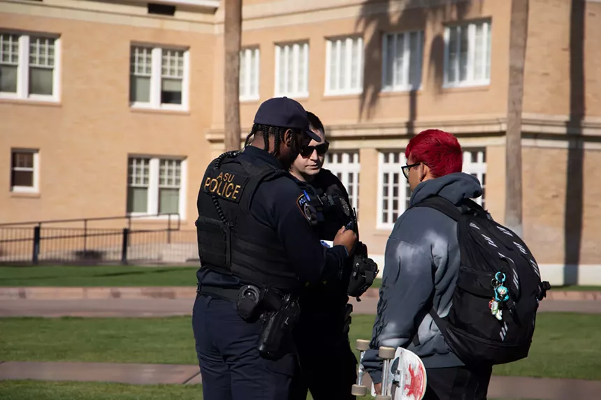 Arizona State University police issue a citation to a student.