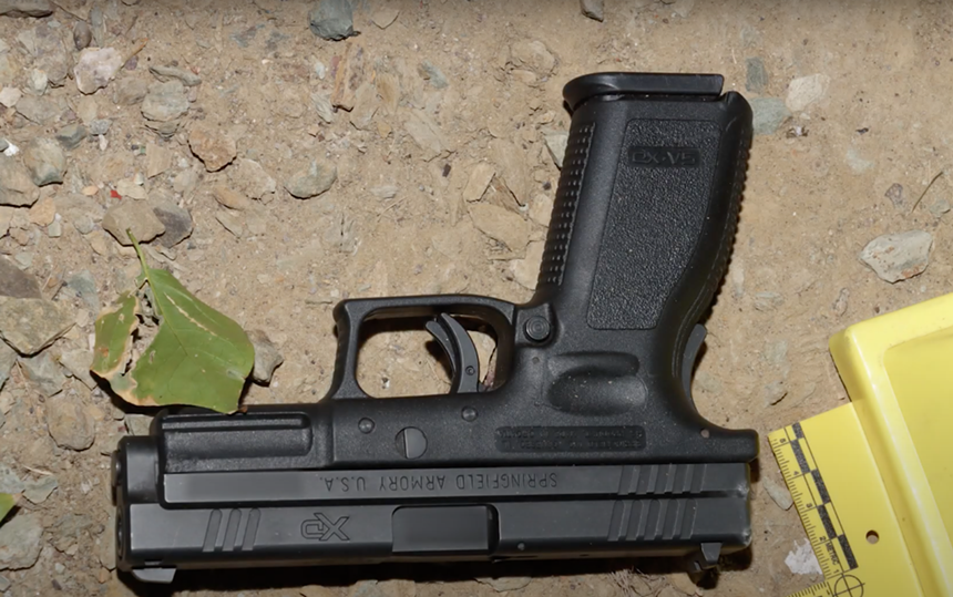 a handgun on the ground