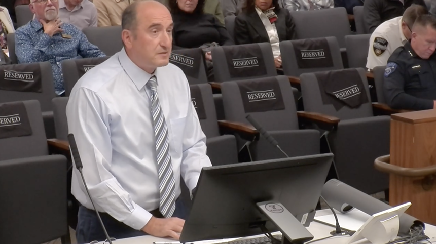 a man at a city council meeting