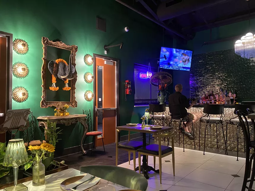 Dining room walls at LeDu Thai are enveloped in a rich emerald green.