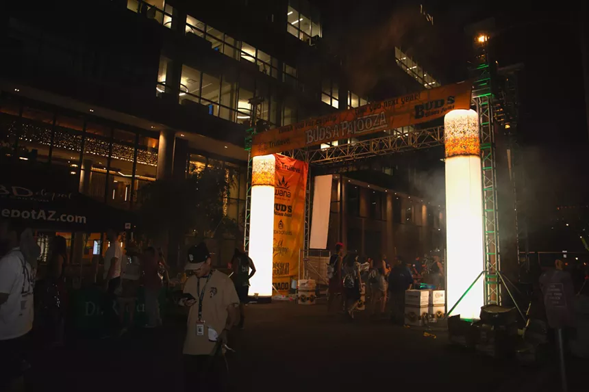 people leave through a lighted arched exit that says "buds-a-palooza"