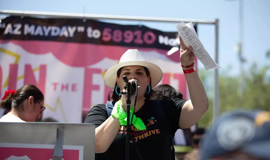 raquel teran speaks into a microphone