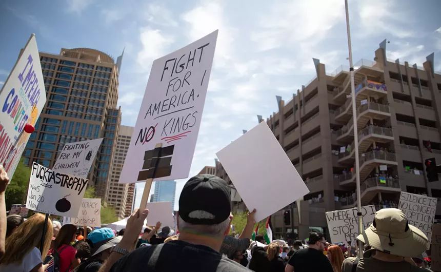 protesters march down a street
