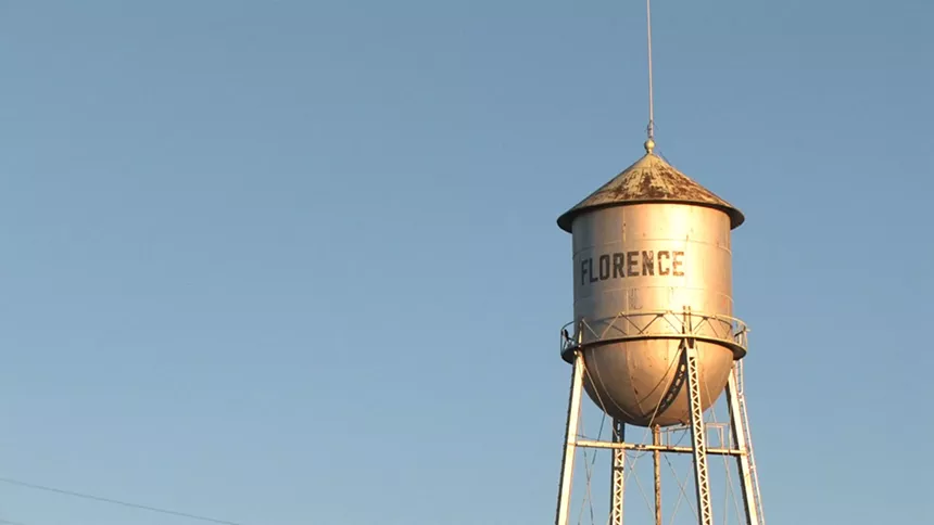 a water tower that says "florence"