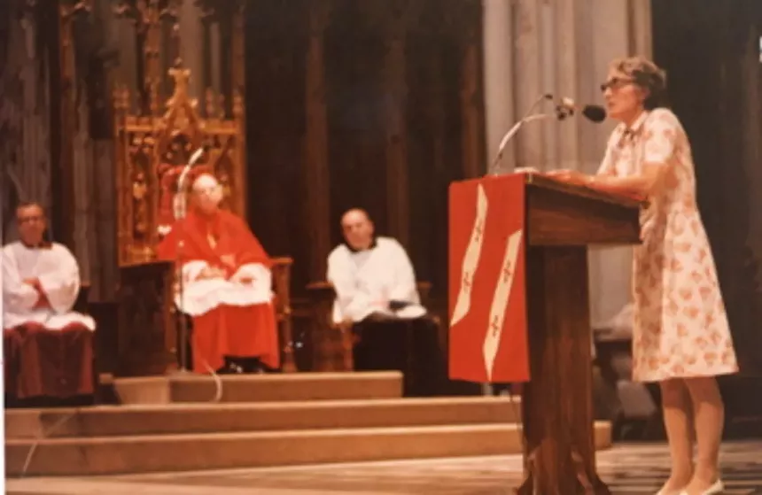 a woman speaks at a church
