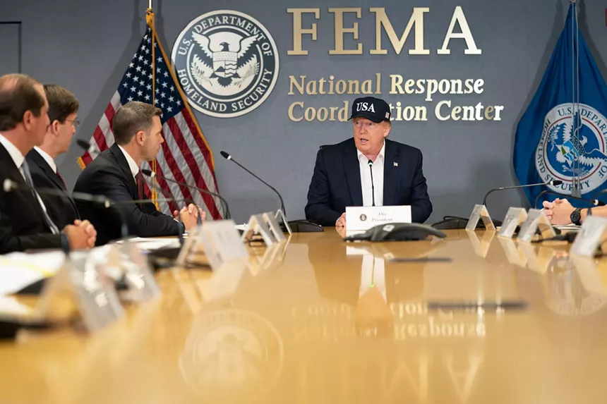 Donald Trump in a FEMA meeting room