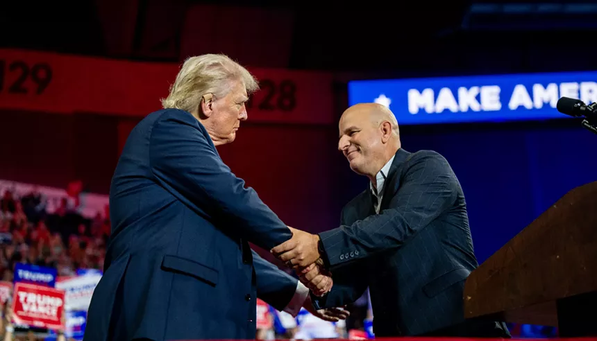 brandon judd and donald trump shake hands at a campaign rally
