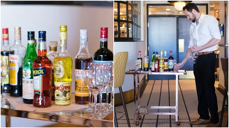 Head bartender Conor Cook loads up the amaro cart with a wide variety of the Italian liqueur. - SHELBY MOORE